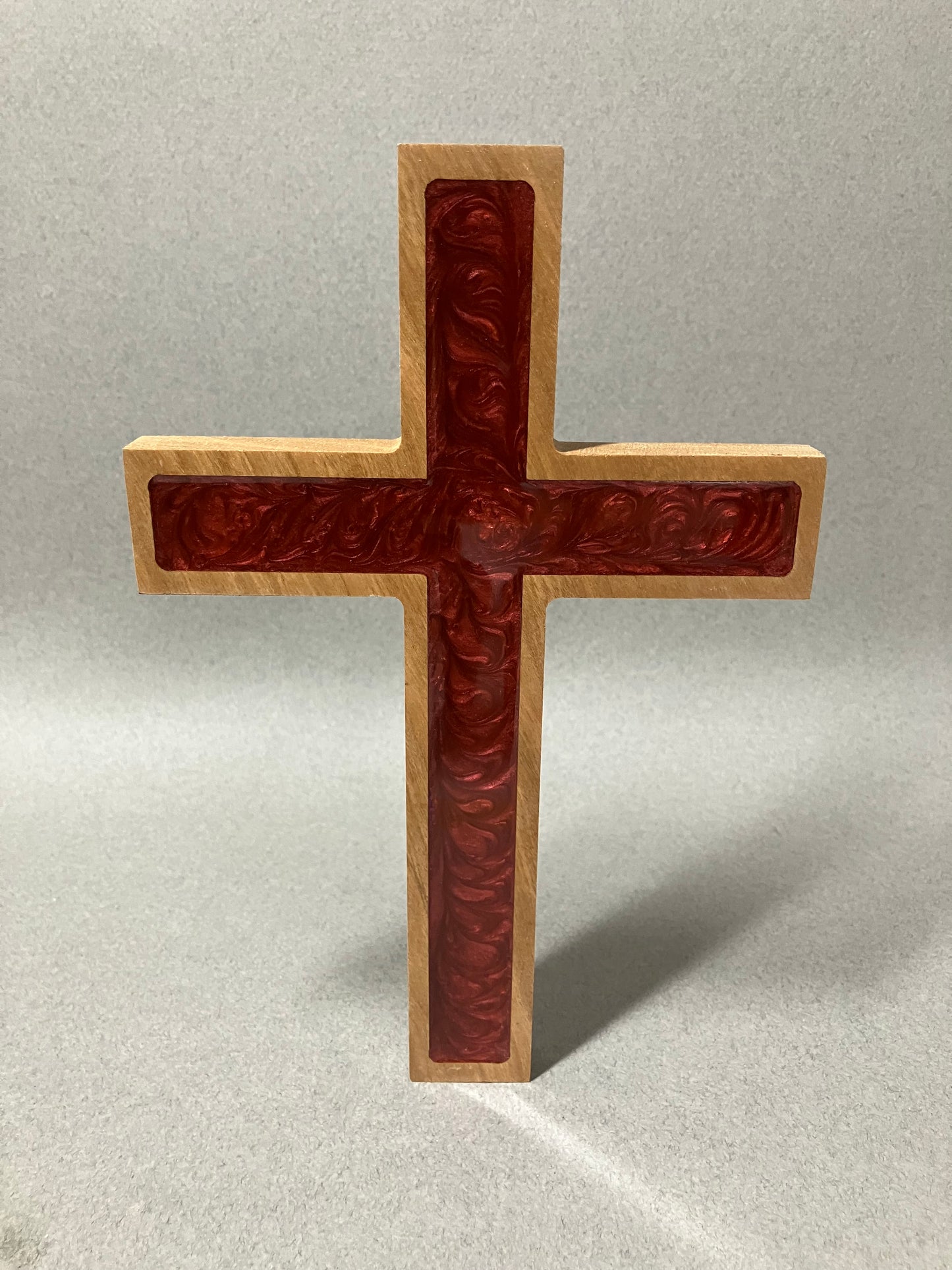 Three crosses on a hill and a red cross.