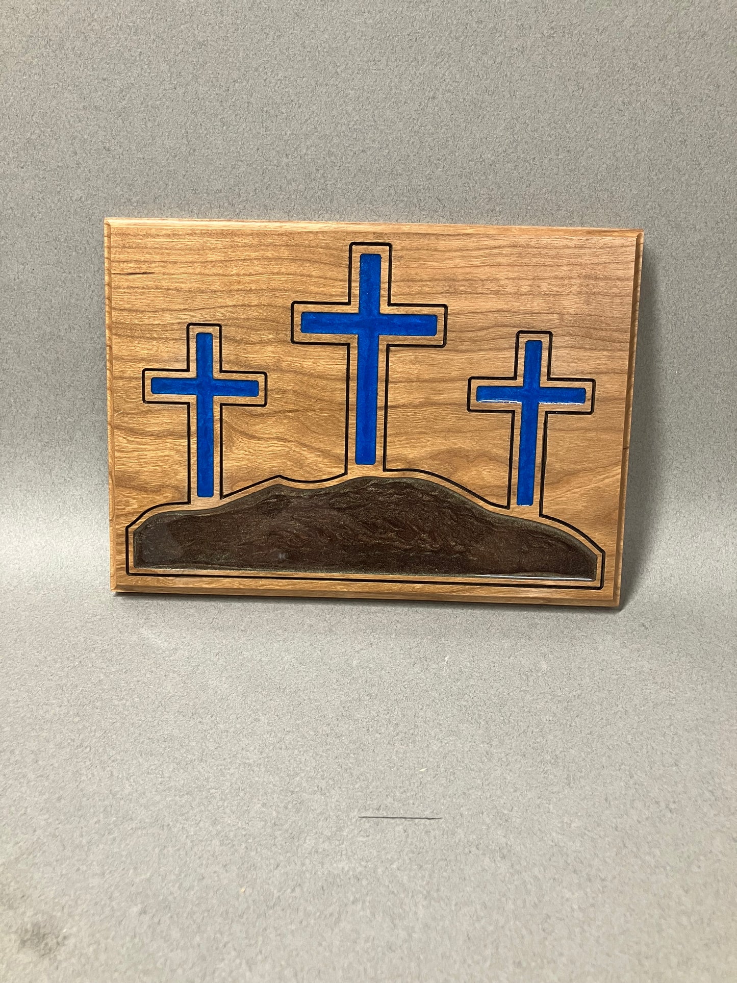 The three crosses on a hill in blue.